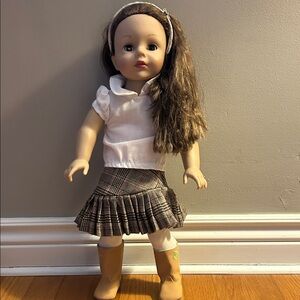 Stylish American Girl Doll Brown-Haired Doll with White Top and Plaid Skirt.